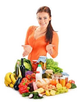 Young woman with assorted grocery products isolated on white background