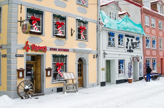 Street of Old Riga in snow day before Christmas