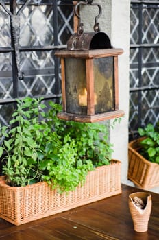 Lantern above a little table of street cafe
