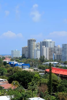 FORT LAUDERDALE, FLORIDA - APRIL 16, 2013:  Aerial view of many tall residential condominiums and other commercial and private dwellings along the Atlantic Ocean waterfront on a sunny spring day.