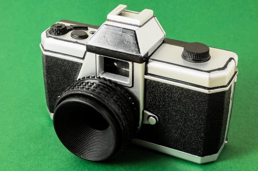 Classic 35mm Plastic Toy Photo Camera on a Colored Background