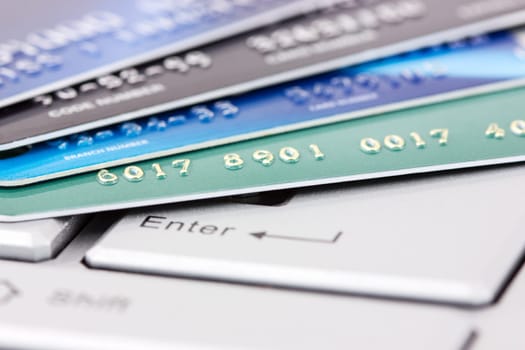 Close up of credit cards on a computer keyboard. Concept of internet purchase