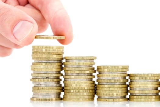 Hand put coins to stack of coins on white background. Investment or growth concept