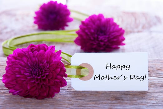 Label with Happy Mothers Day and Purple Flowers and Green Ribbon