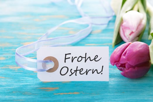 Banner with the german words Frohe Ostern which means Happy Easter on turquiose background