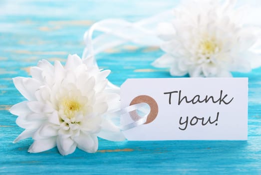 Turquoise Background with White Flowers and Thank You Label