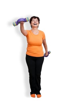 Happy mature fitness woman excercising with barbells - isolated on white