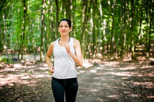 Jogging for health - young training in forest