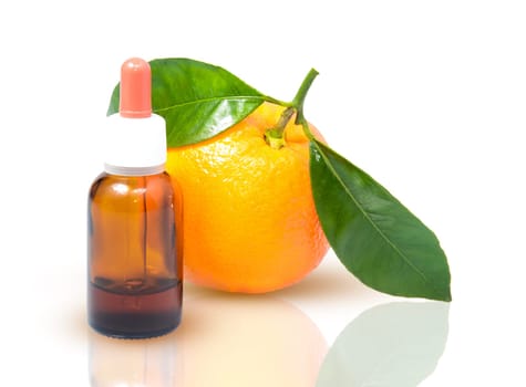 Orange with green leaves and a bottle with dropper isolated on a white background. Alternative medicine concept