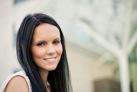Portrait of young beautiful woman - outdoor with copy space