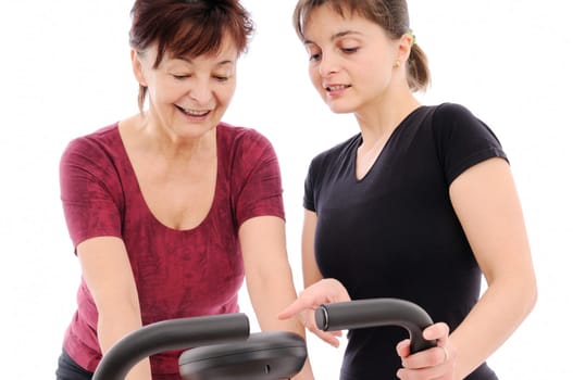 Spinning senior woman with coach