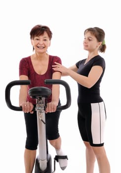 Spinning senior woman with coach