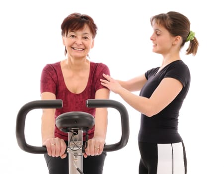 Spinning senior woman with coach