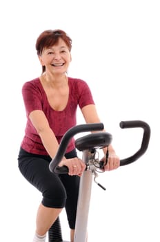 Spinning - smiling senior woman - isolated