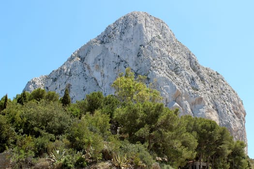 Natural Park of Penon de Ifach situated in Calp, Spain. A massive limestone outcrop emerging from the sea and linked to the shore by rock debris. Is home to numerous rare plants and over 300 species of animals, and nesting site for sea birds and other birds.