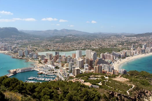 Panoramic view over Calp (Spain). Town bay beach