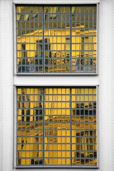 The photograph of a mirrored house in a façade with many small mirrors.