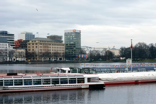 Hamburg,Germany – January 02,2014: Two excursion boats are moored on the Alster in Hamburg's city centre on January 2,2014 in Hamburg.