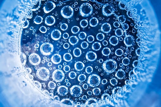 Blue transparent water splashes on white background