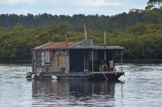 Houseboat made of corrugated iron and wood with lots of decoration