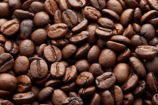 Close-up of brown coffee beans, background texture
