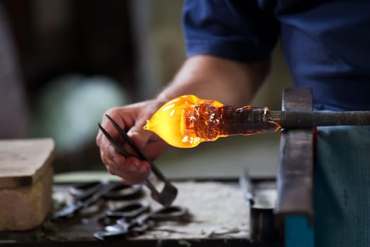 Glass blower forming beautiful piece of glass, Murano, Venice, Italy