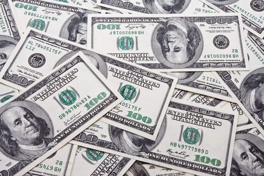 Lots of dollar notes arranged in chaotic manner, background