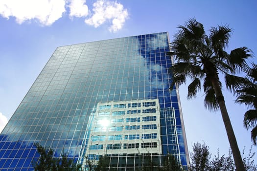 The sky is reflected in a high-rise building