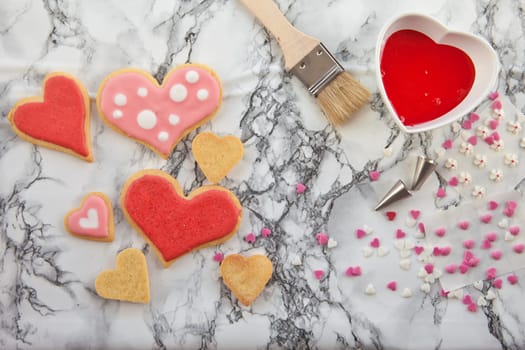Heart-shaped colorful cookies decorate with frosting and décor