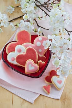 Red plate with colorful heart-shaped places
