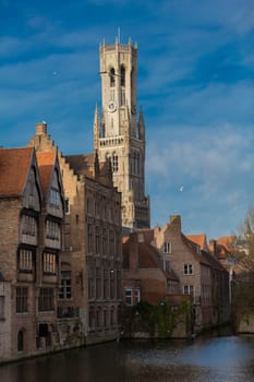 The Belfry in Bruegge behind historic houses