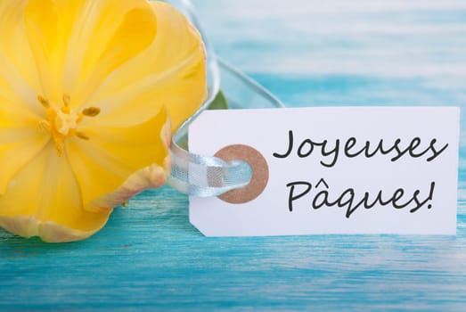 Background with Label with the French Words Joyeuses Paques which means Happy Easter