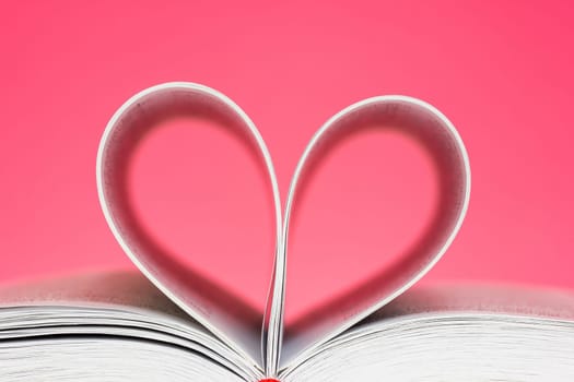 Pages of  book curved into a heart shape