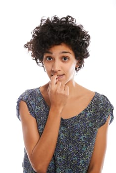 Portrait of confused and uncertain hispanic woman biting nail on white background and looking at camera