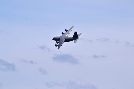 Gray plane high in the sky
