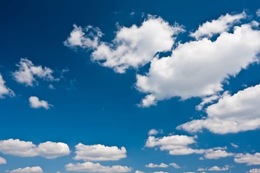 White clouds in blue summer sky background