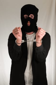 Black Dressed Young Man Traped in Handuffs