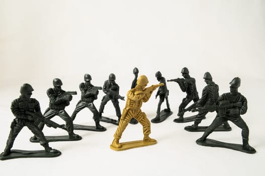Plastic Lead Soldiers Representing War on a White Background