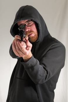 Black Dressed Young Man Holding a Pistol Gun