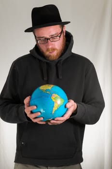 Black Dressed Young Man Holding a Globe Earth