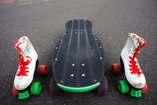 Vintage Style Longboard Black Skateboard on an Empty Asphalt Desert Road