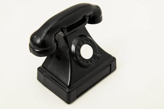 Vintage Old Telephone Plastic Black Toy on a White Background