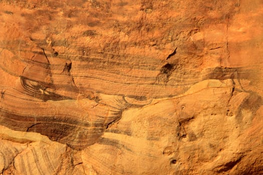 Grain pattern on red sandstone rock face