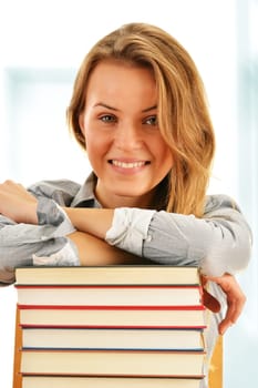 Female student with books in the library