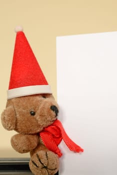Christmas greetings,teddy bear with a blank card