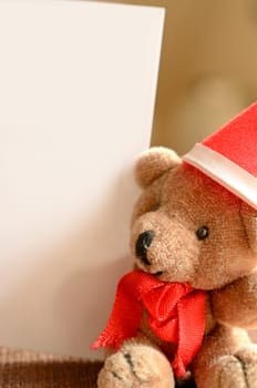 Christmas greetings,teddy bear with a blank card