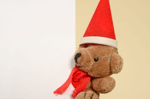 Christmas greetings,teddy bear with a blank card