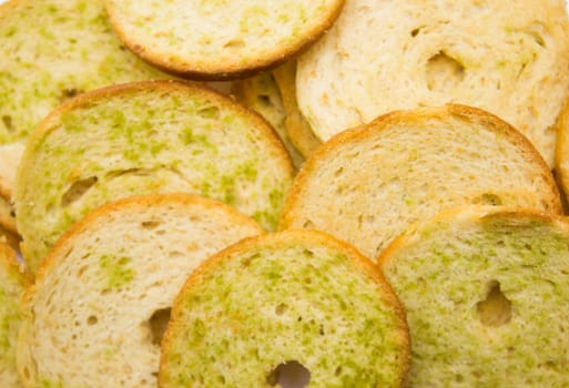 Healthy bruschettas baked with green herbs.