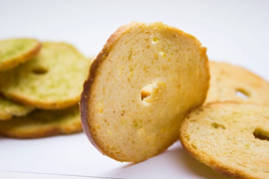 Healthy bruschettas baked with green herbs.