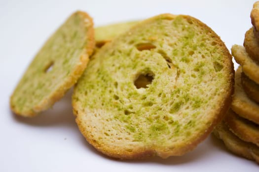 Healthy bruschettas baked with green herbs.